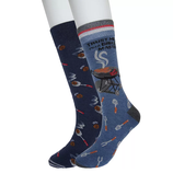 A pair of blue crew socks featuring barbecue-themed graphics; one sock has text saying \“Trust me, I'm a grill master\“ with a grill image, and the other displays various grilling tools and utensils.