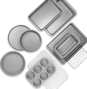 Various baking pans including round cake pans, a muffin tin, rectangular baking dishes, and a loaf pan.