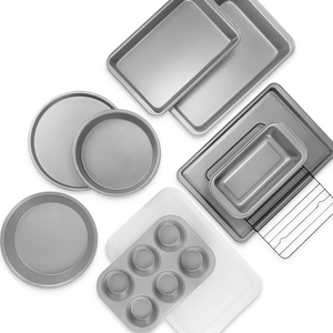 Various baking pans including round cake pans, a muffin tin, rectangular baking dishes, and a loaf pan.