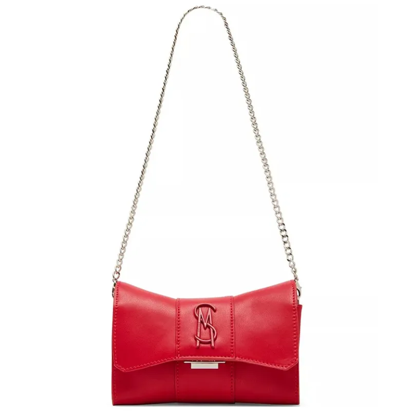Red Steve Madden Briaa Mini Crossbody Bag with a bow shape, chain strap, and embossed logo on the front.