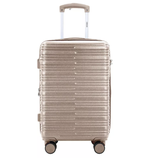 A gold hard-shell suitcase with grooved design, featuring four spinner wheels and a telescopic handle labeled \“IZOD.\“