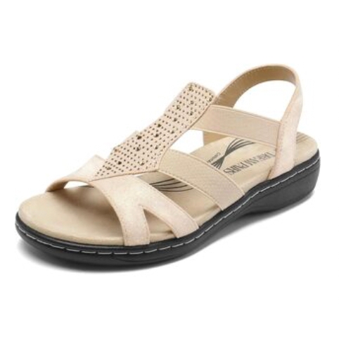 Beige sandal with slingback strap, perforated design on the upper, and cushioned footbed. Features a low, black sole with visible stitching for added support and comfort.