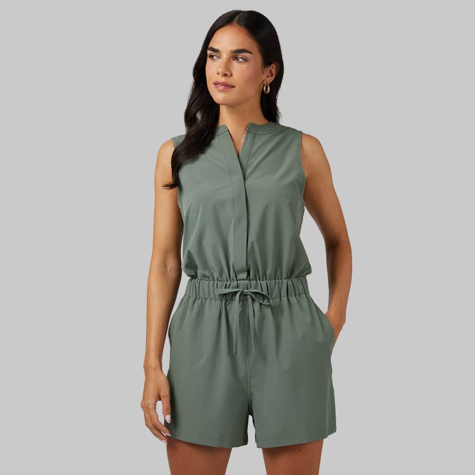 A sleeveless olive green romper with a V-neckline, cinched waist with drawstring, and tailored shorts.