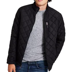 A black quilted jacket with a front zipper and zippered chest pocket, worn over a gray sweater and paired with blue jeans.