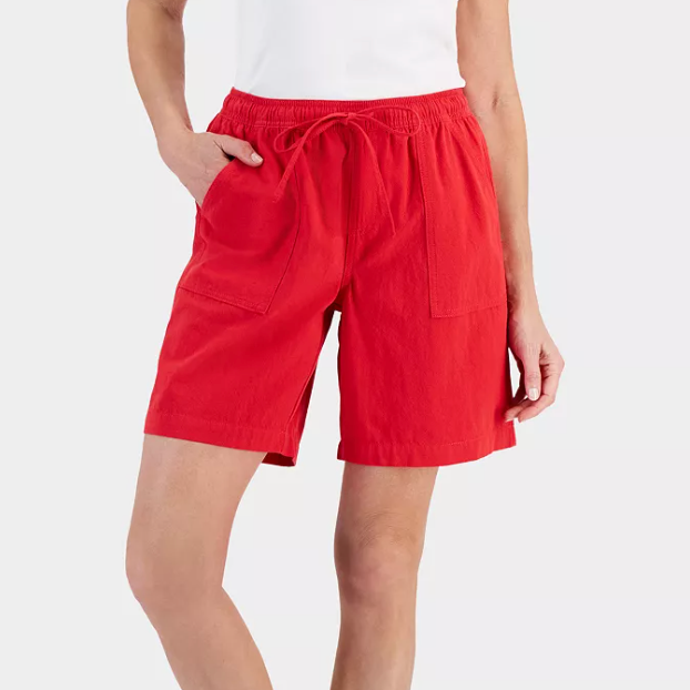 Red shorts with an elastic waistband and a front tie, featuring side pockets.