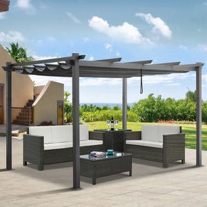 Outdoor patio set with a pergola, featuring two cushioned sofas, a matching armchair, a central coffee table with a glass top, and a side table, all in a woven rattan design.