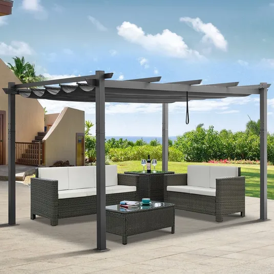 Outdoor patio set with a pergola, featuring two cushioned sofas, a matching armchair, a central coffee table with a glass top, and a side table, all in a woven rattan design.