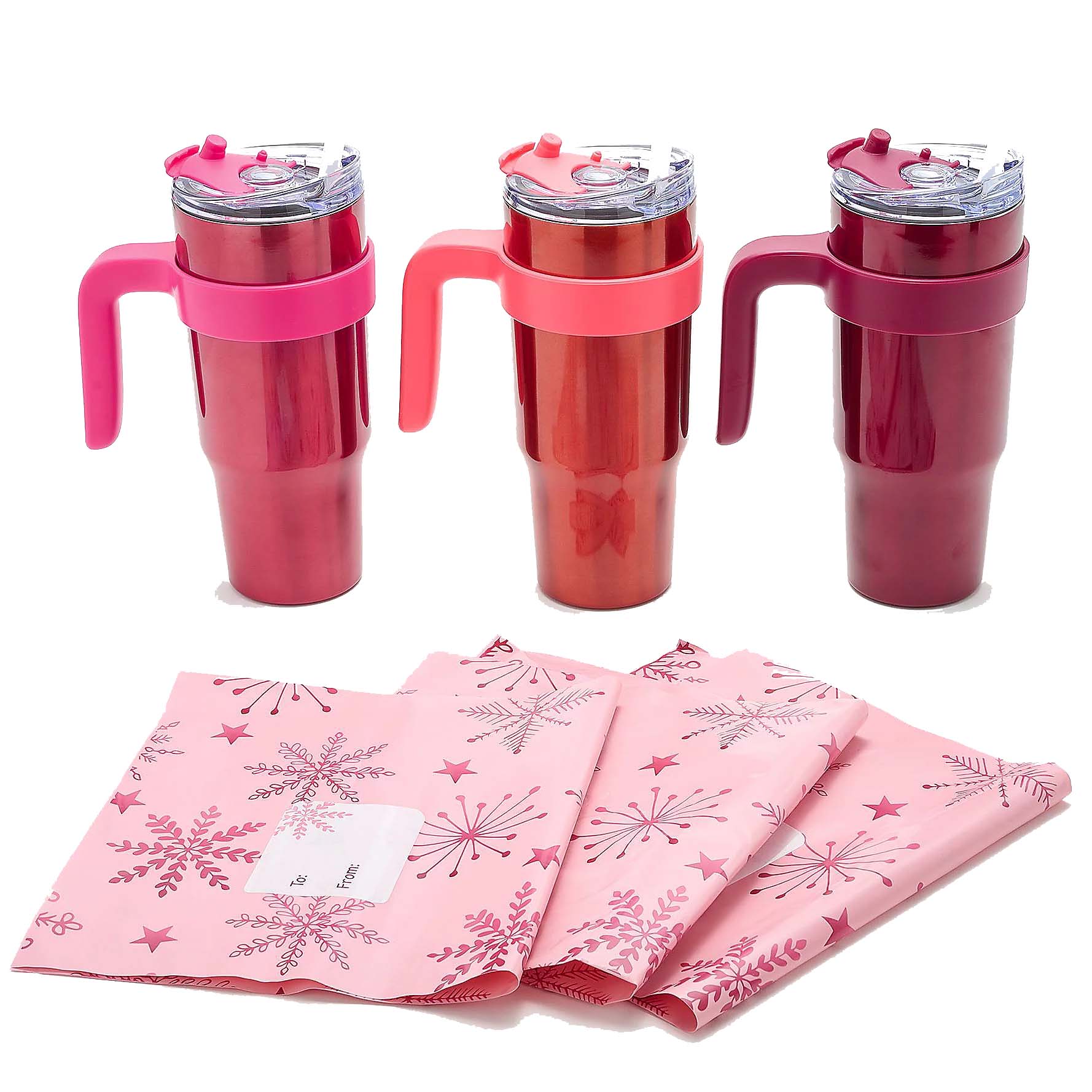 Three pink and red stainless steel travel mugs with handles and lids are displayed alongside pink gift wrap featuring snowflake and star patterns.