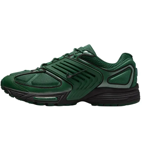 A green athletic shoe with black accents, featuring a distinctive overlay design and a low-top silhouette, likely a Nike model.