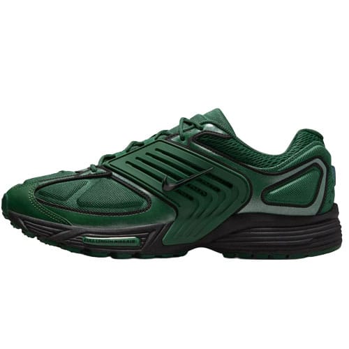 A green athletic shoe with black accents, featuring a distinctive overlay design and a low-top silhouette, likely a Nike model.