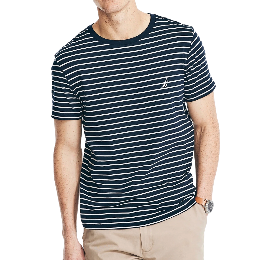 Striped navy and white T-shirt paired with beige pants.