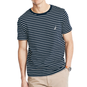 Striped navy and white T-shirt paired with beige pants.