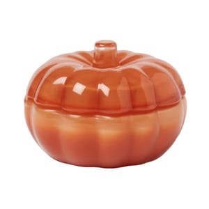 Orange ceramic pumpkin-shaped container with a lid, featuring a glossy finish.