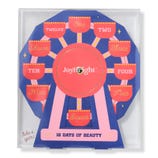 A \“JoyBright 12 Days of Beauty\“ set designed like a Ferris wheel features numbered compartments one to twelve for beauty products.
