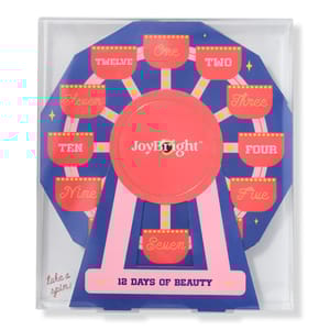 A \“JoyBright 12 Days of Beauty\“ set designed like a Ferris wheel features numbered compartments one to twelve for beauty products.