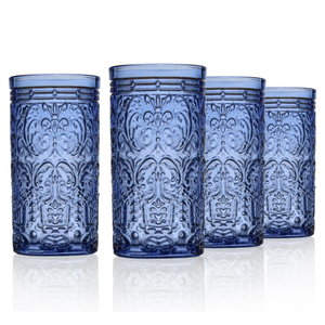 Four tall, blue drinking glasses feature an ornate, embossed pattern.
