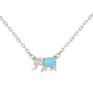A delicate silver chain necklace featuring a small elephant charm with a turquoise oval body and a small gem set in the ear.