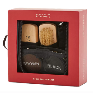 Perry Ellis Portfolio 7-piece shoe shine kit includes a brown and a black polish, two brushes, and various tools for polishing shoes. Compactly packaged in a red box with a clear front for easy viewing.