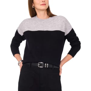 Color-block sweater in black and gray, paired with black pants and a black belt with a silver buckle.
