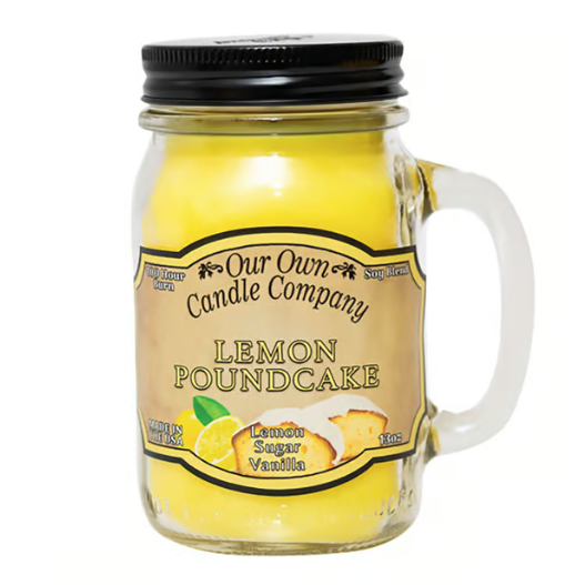 A jar candle from Our Own Candle Company labeled \“Lemon Poundcake,\“ with scents of lemon, sugar, and vanilla, made from soy blend wax.