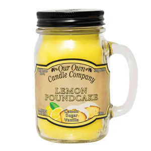 A jar candle from Our Own Candle Company labeled \“Lemon Poundcake,\“ with scents of lemon, sugar, and vanilla, made from soy blend wax.