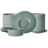 A set of sage green dinnerware featuring plates and bowls with a ribbed texture around the edges and sides.