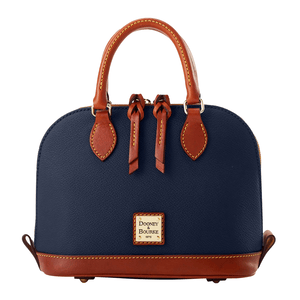 Dooney & Bourke Kirby Bitsy Bag features a dome-shaped design with navy blue leather, brown leather handles, and trim. It has a gold logo plaque and dual top handles with decorative tassels.