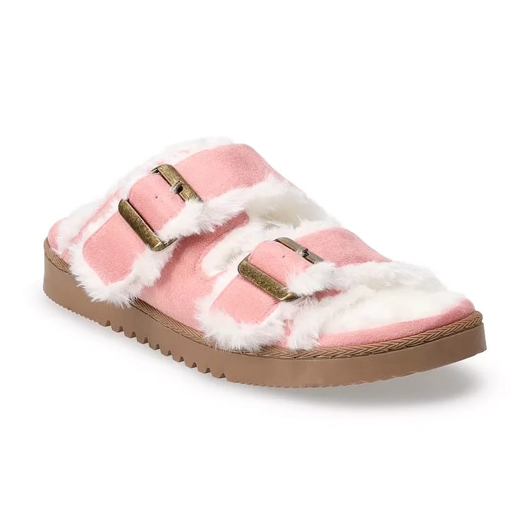 Pink slip-on sandal slippers with faux fur trim and lining, featuring two adjustable buckles on top and a brown, textured sole.