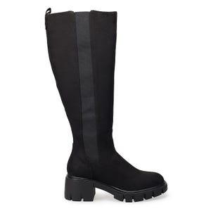 Black knee-high boots with a wide calf, stretchy side panels, and chunky treaded soles.