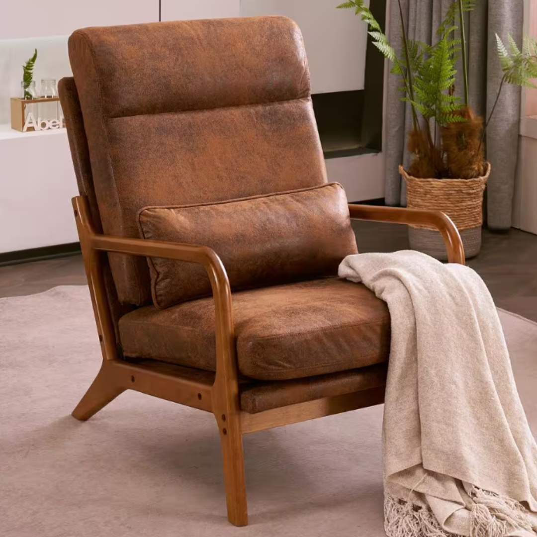 A brown upholstered armchair with wooden armrests and a cream-colored throw blanket draped over one side.