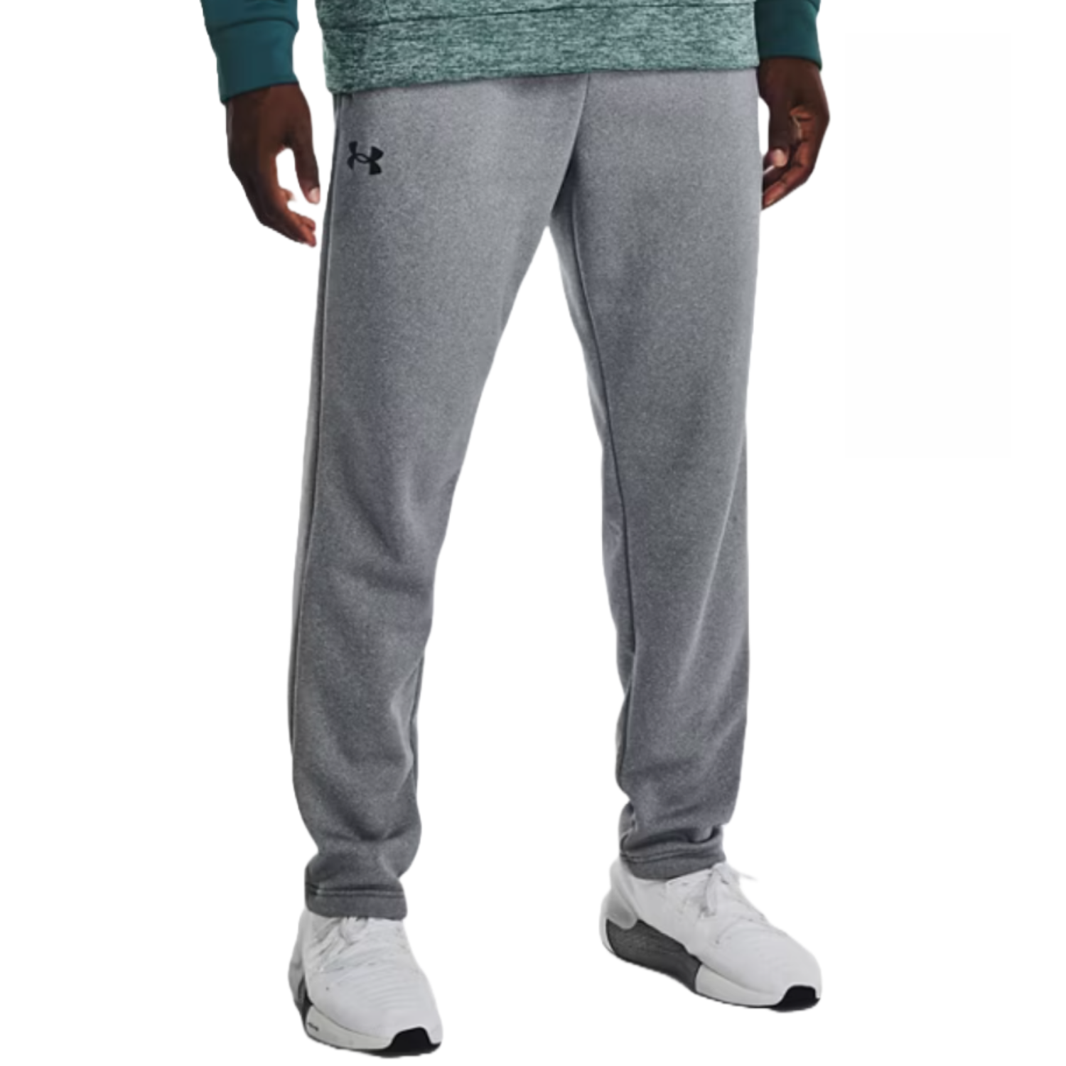 Gray sweatpants with a logo on the left thigh, paired with white sneakers.