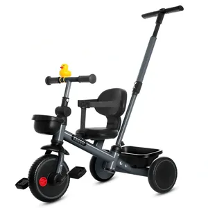 A children's tricycle with a rubber duck on the handlebars, a rear push handle, a seatbelt, and a storage basket on the back.