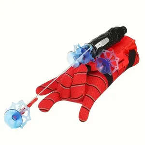 Red glove with a black web shooter toy attached, featuring blue suction cup projectiles.