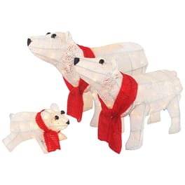 Three wooden polar bear decorations with red scarves, depicting a family with one large, one medium, and one small bear.