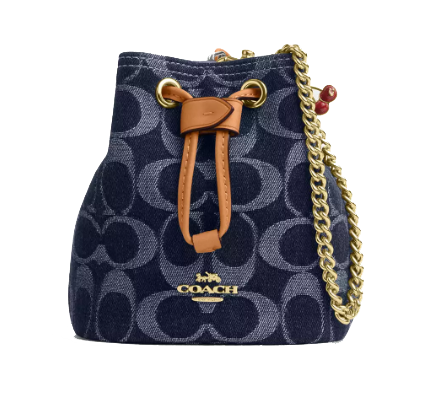 Coach Outlet Drawstring Wristlet in denim features a zip-top closure, signature logo print, leather drawstring detail, and a gold-tone chain strap with red accents.