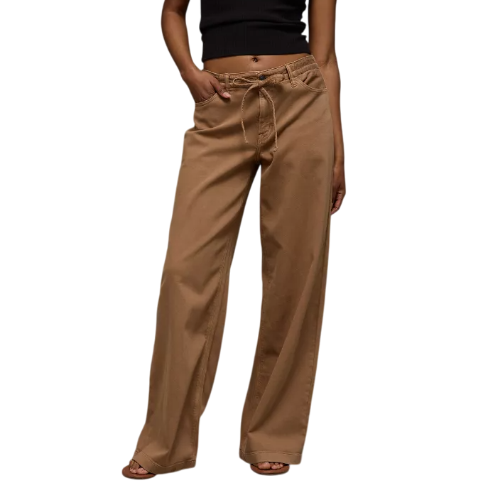 A pair of brown wide-leg pants with a drawstring waist, worn with a black sleeveless top.