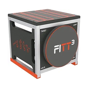 A cube-shaped compact home gym piece features a FITT3 branding and includes elements for various exercises like twist and jump, with handle cutouts and red accents on a black and gray structure.