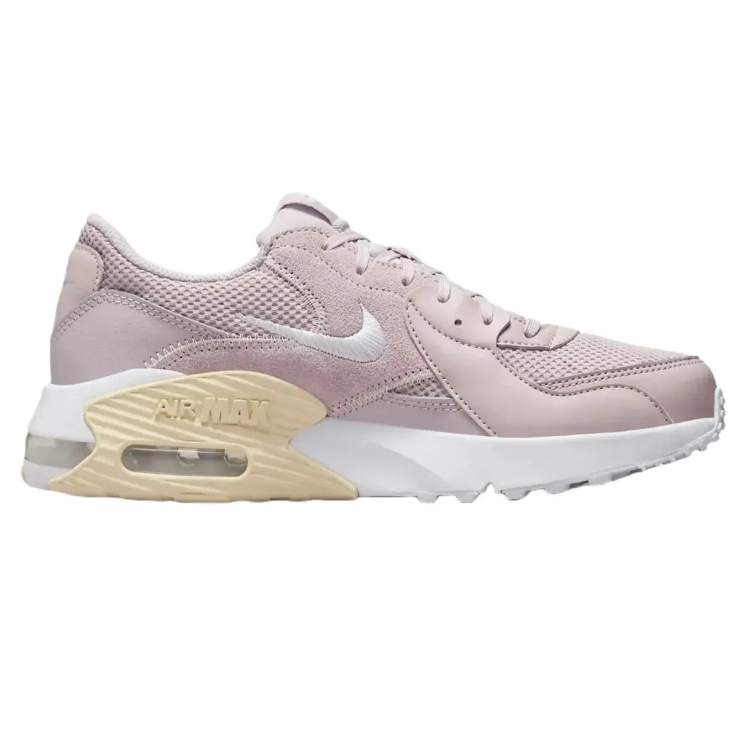 A pink Nike Air Max sneaker with a mesh and suede upper, featuring a visible air unit in the heel and a beige midsole accent.