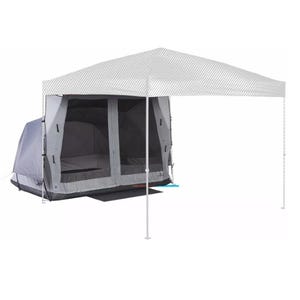 A gray tent is set up under a large white canopy, providing additional shelter and space.
