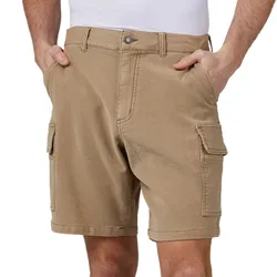 Tan cargo shorts with side pockets, belt loops, and a button closure, being modeled by a person with their hands in pockets.