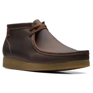 Brown leather lace-up chukka boot with a crepe sole.