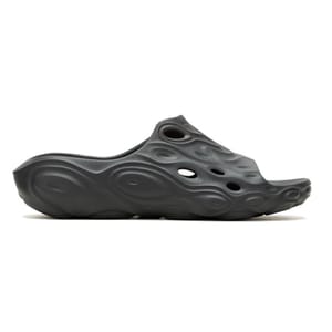 A black, sculpted slip-on sandal with a wavy, textured design and multiple circular cutouts for ventilation.