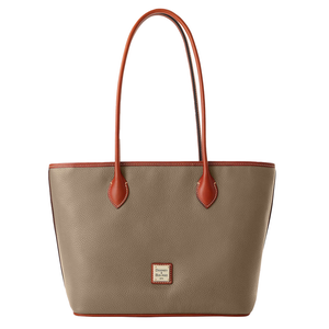 A Dooney & Bourke Pebble Leather Tote featuring a pebbled taupe body with brown leather handles and trim. It includes a small logo patch on the front.