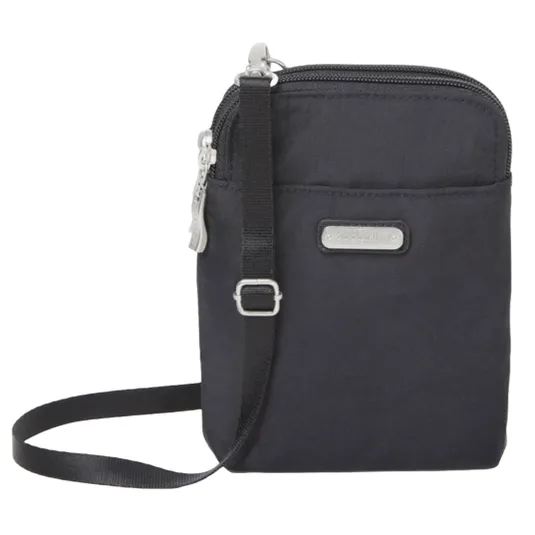 A compact black crossbody bag with a zipper closure and adjustable strap, featuring a metal logo plate on the front.