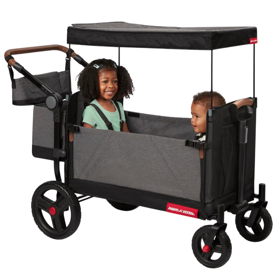 A stroller wagon featuring two children sitting inside, equipped with a canopy for shade, a storage compartment, and large wheels for easy mobility.