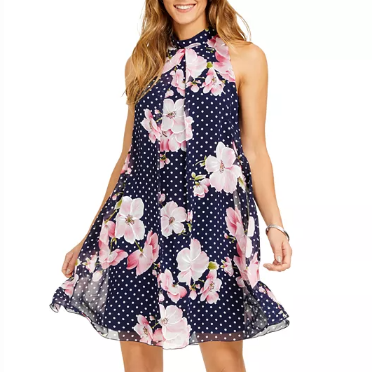 Sleeveless A-line dress featuring a navy blue chiffon fabric with white polka dots and large pink floral patterns, high neckline, and a flowy silhouette.