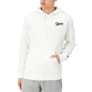 A person is wearing a white Champion hoodie with a kangaroo pocket and gray sweatpants. The hoodie features the Champion logo on the chest and sleeve.