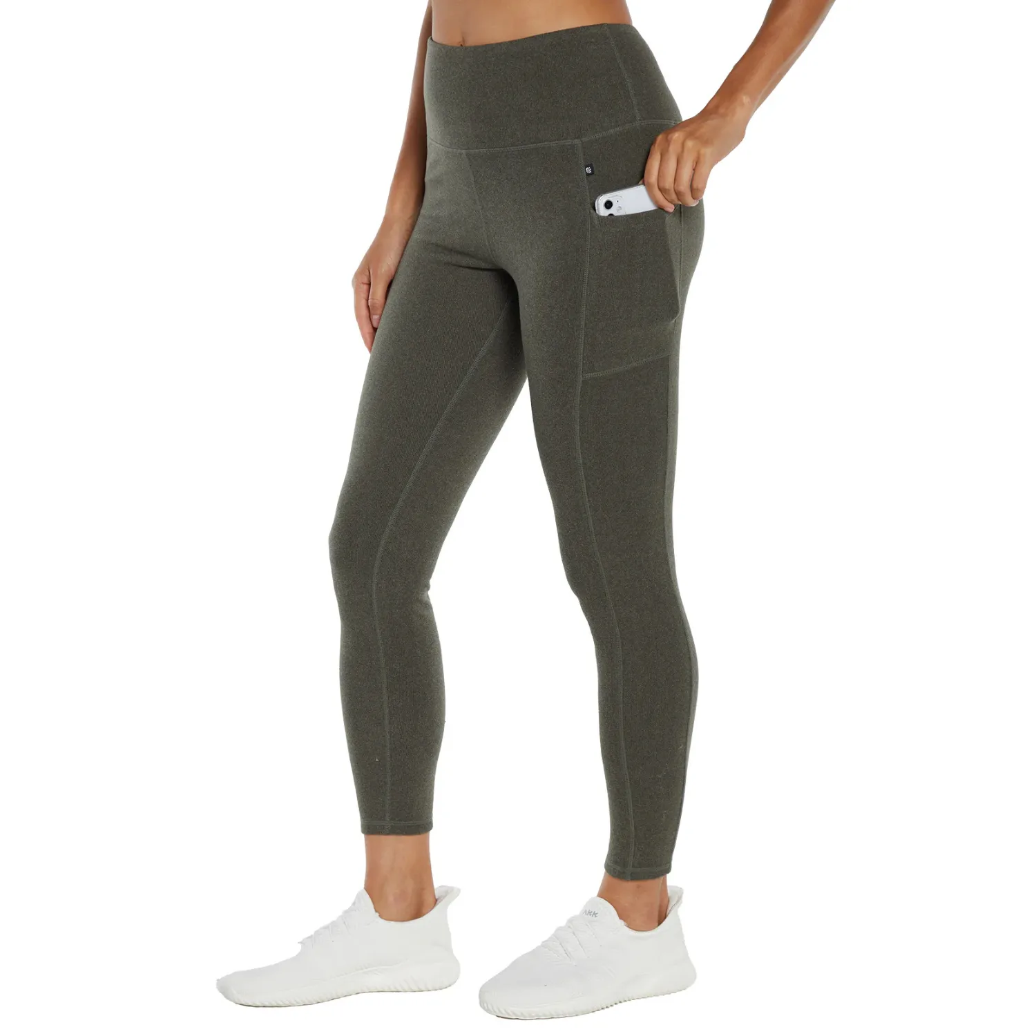 Olive green, high-waisted leggings featuring side pockets are fitted, showcasing a sleek and functional design suitable for active wear.