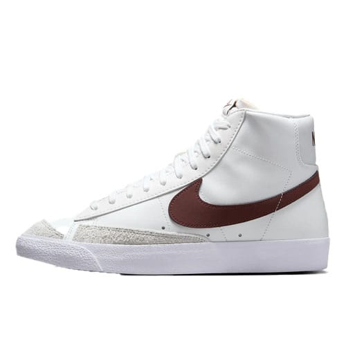The Nike Men's Blazer Mid '77 Shoes feature a white leather upper with a brown swoosh, have a high-top design, and are accented with a textured white rubber sole and a light gray suede section on the front.