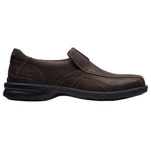 Brown slip-on shoe with contrast stitching and a black sole, featuring the Clarks logo.